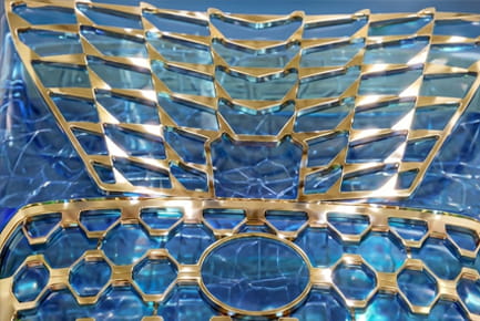 Decorative and durable coating for automotive front grille components